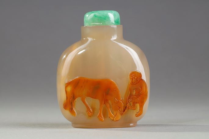 Agate snuff bottle carved in the light brown vein of a horse and a monkey | MasterArt